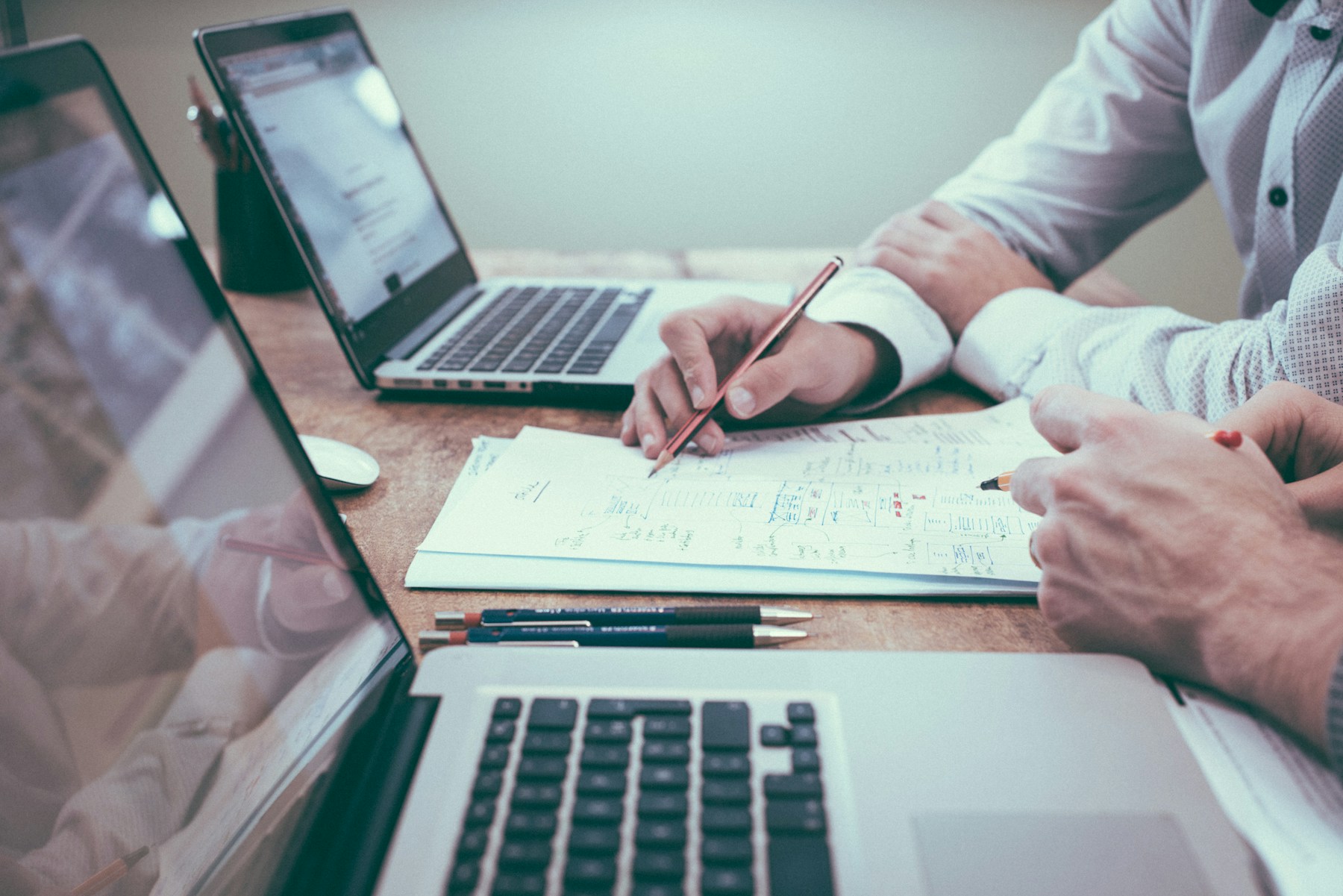 Illustrative photograph of a business consultation with financial documents